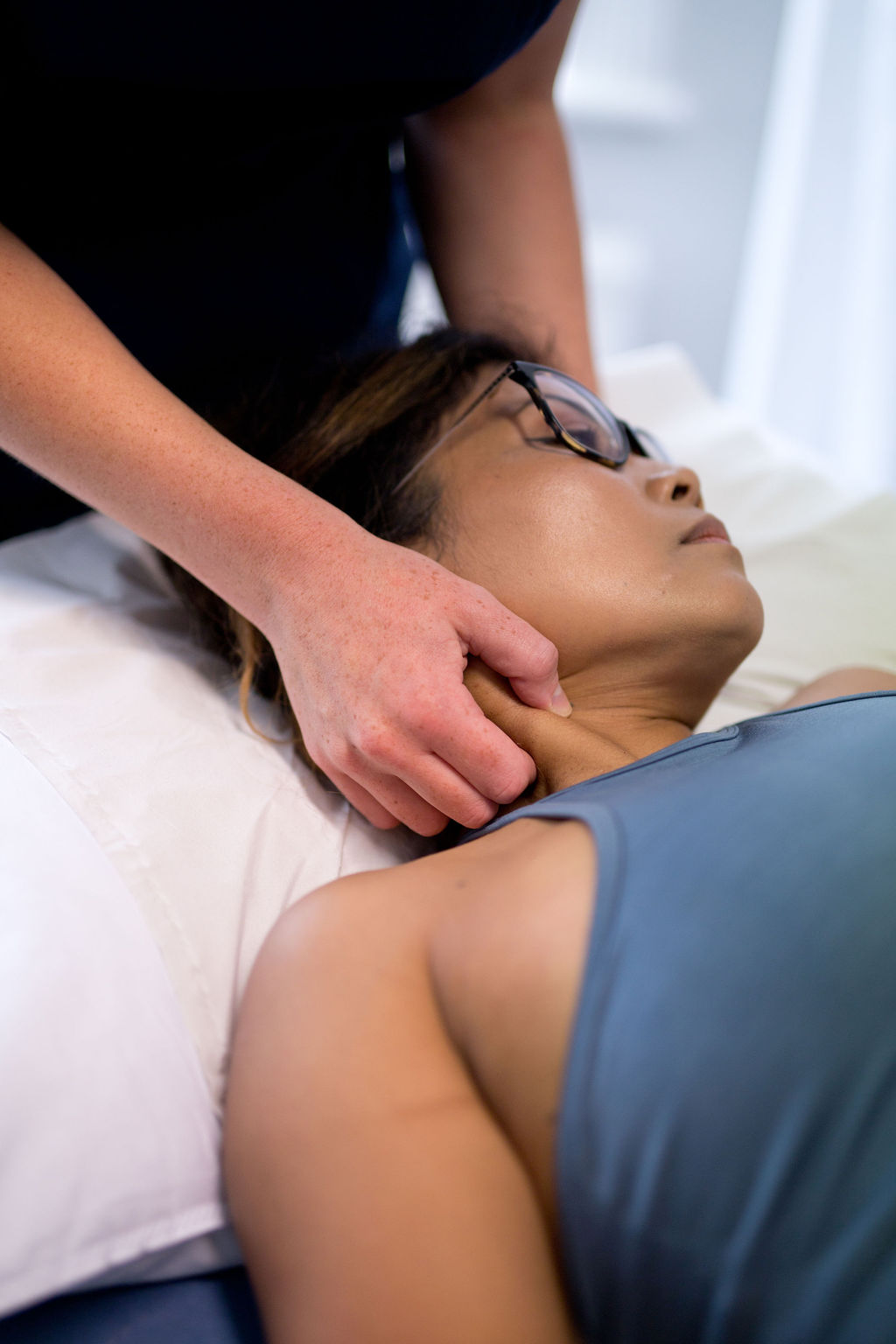 Practitioner providing hands-on treatment at SoCo Therapies