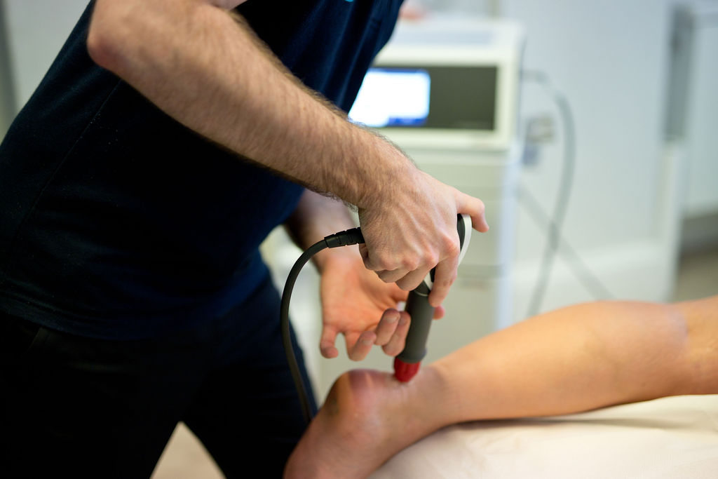 Close-up of shockwave therapy treatment at the Bournemouth clinic